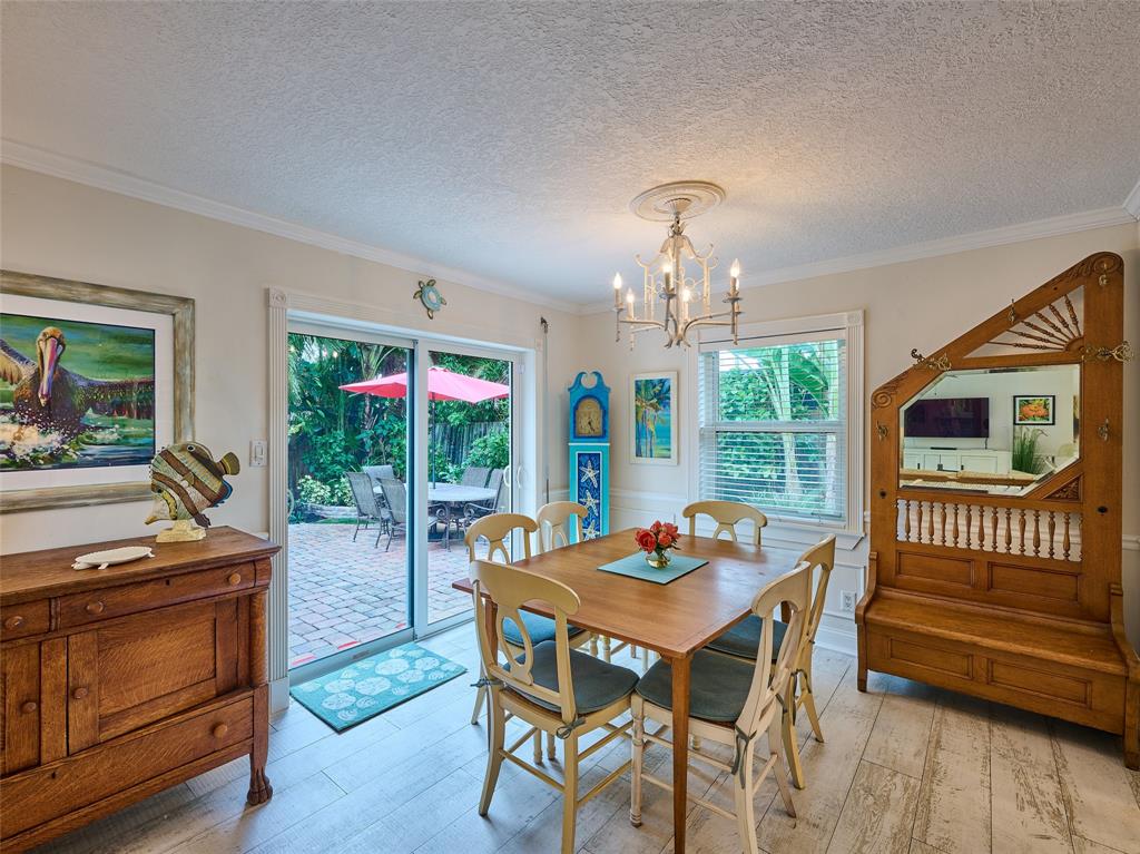 3220 Oleander Way Lauderdale-by-the-Sea, FL 33062 - Photo 14 of 50 a view of a dining room with furniture window and outside view