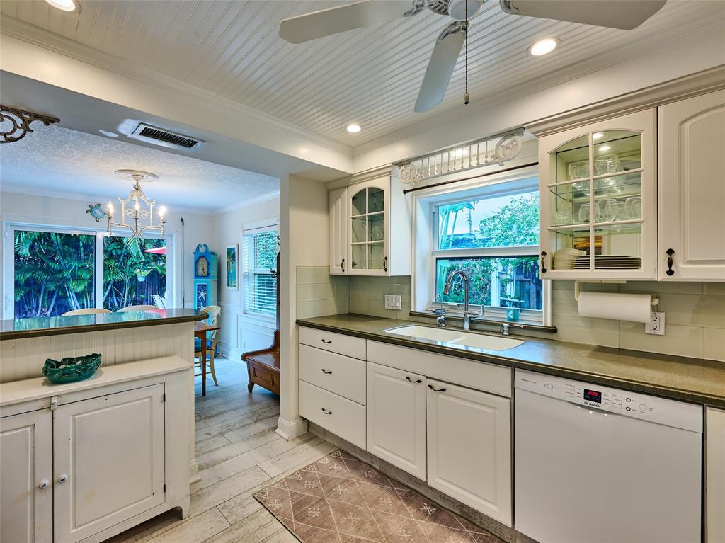 3220 Oleander Way Lauderdale-by-the-Sea, FL 33062 - Photo 17 of 50 a kitchen with sink and window