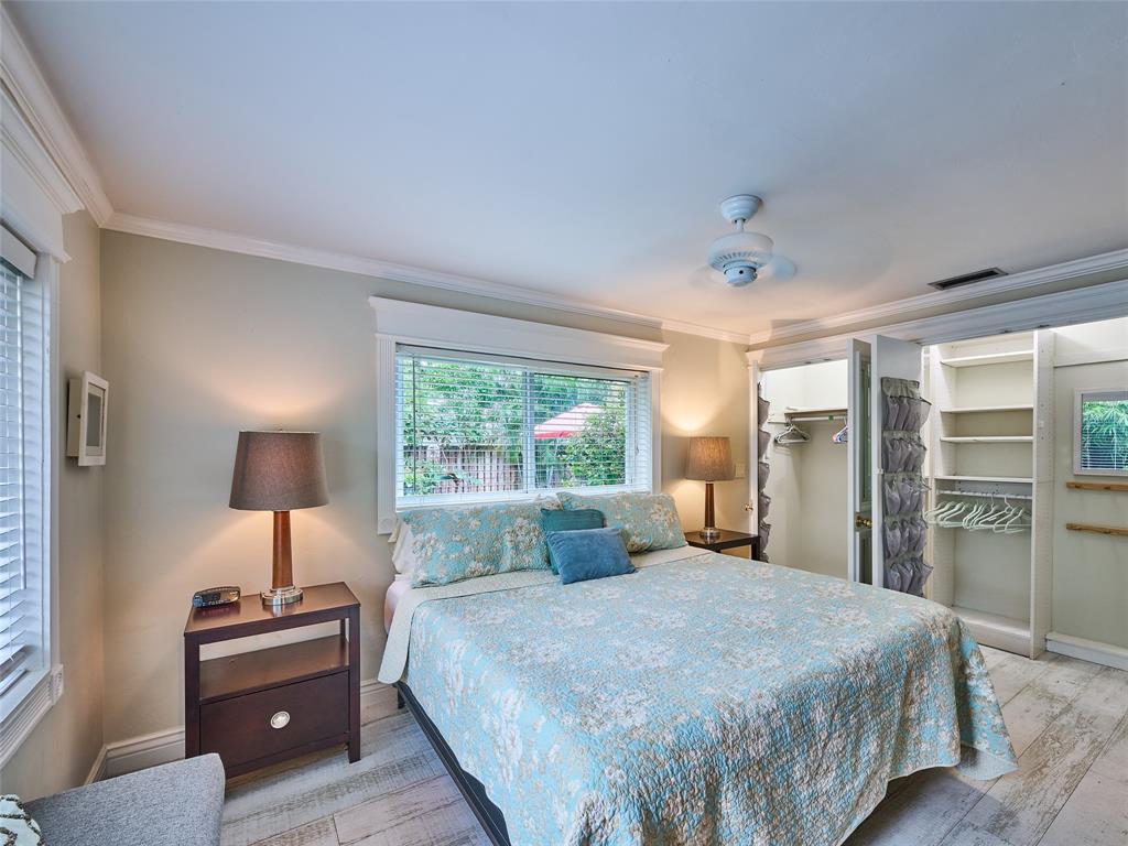 3220 Oleander Way Lauderdale-by-the-Sea, FL 33062 - Photo 26 of 50 a bedroom with a large bed and a large window