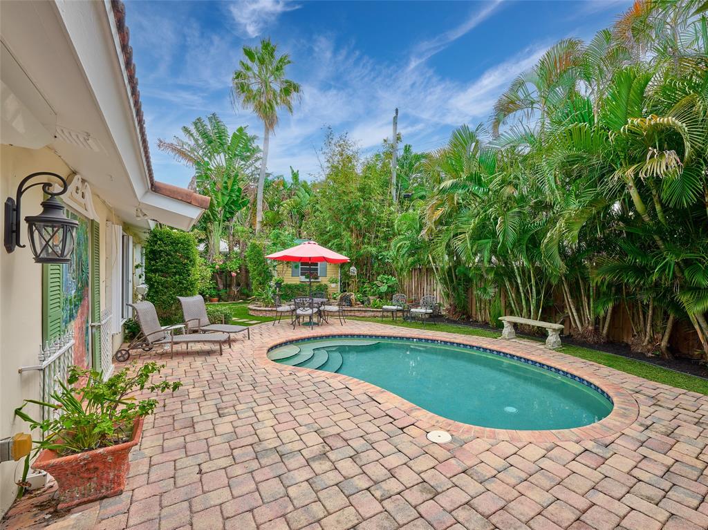 3220 Oleander Way Lauderdale-by-the-Sea, FL 33062 - Photo 30 of 50 a view of a swimming pool with a patio
