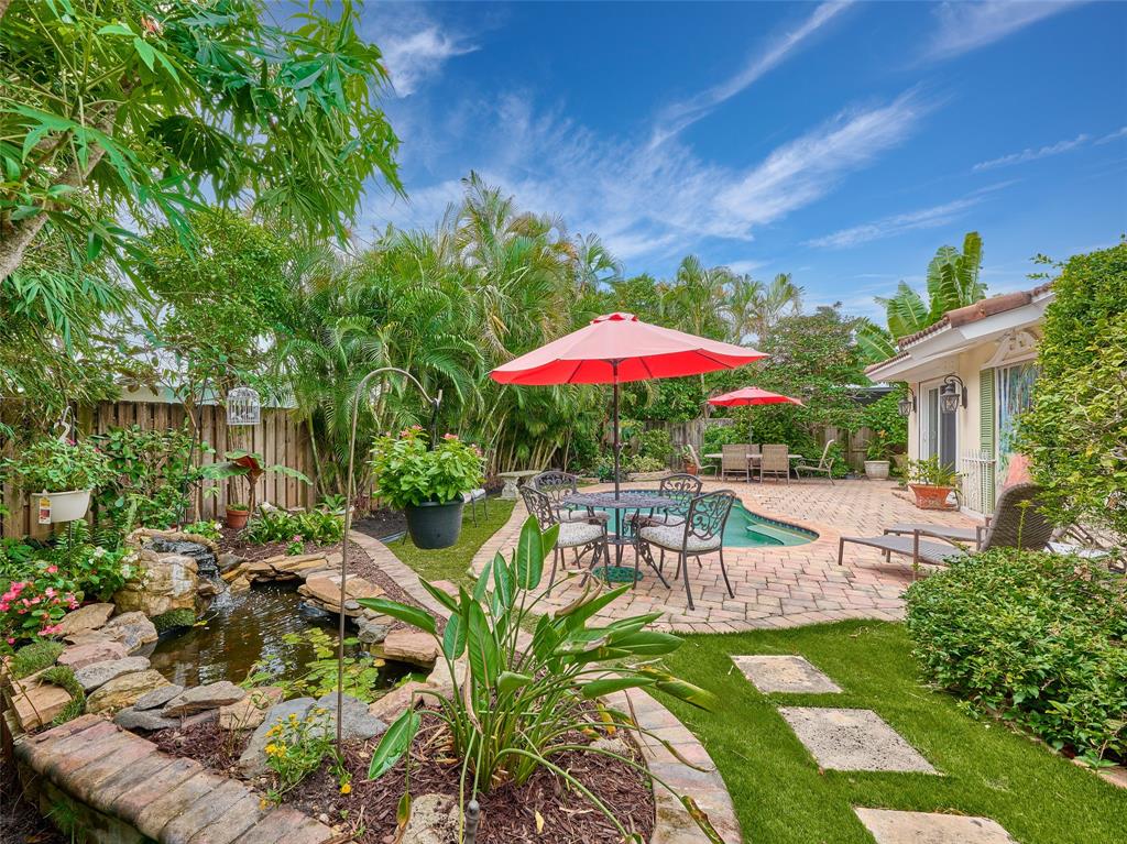3220 Oleander Way Lauderdale-by-the-Sea, FL 33062 - Photo 36 of 50 a view of a house with backyard sitting area and garden