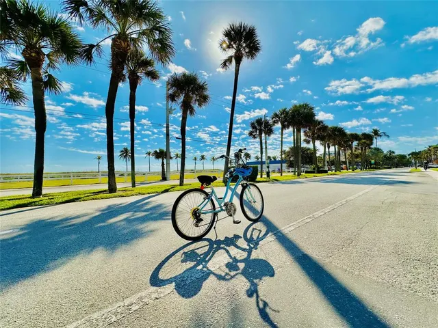 a view of a swimming pool with a table and chairs