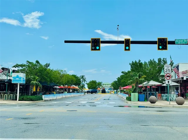 a view of street with lots of trees