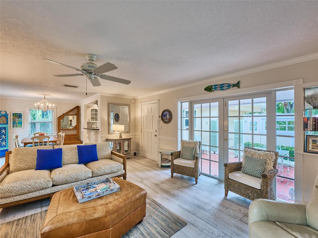 3220 Oleander Way Lauderdale-by-the-Sea, FL 33062 - Photo 10 of 50 a living room with furniture and a large window
