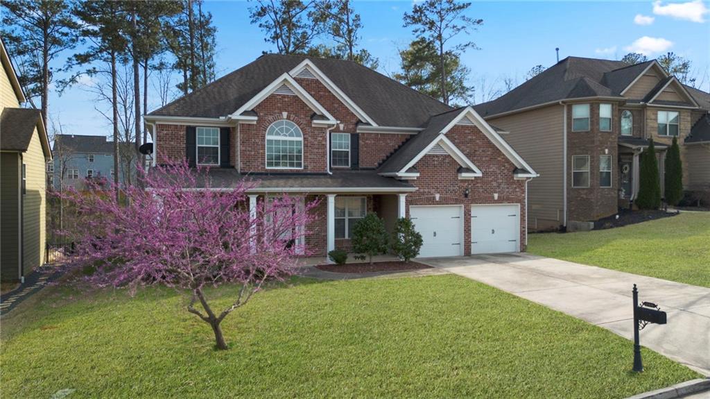 268 Clubhouse Crossing Acworth, GA 30101 - Photo 1 of 48 a front view of a house with a garden