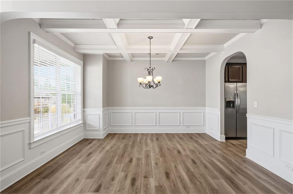 268 Clubhouse Crossing Acworth, GA 30101 - Photo 11 of 48 a view of empty room with wooden floor and fan
