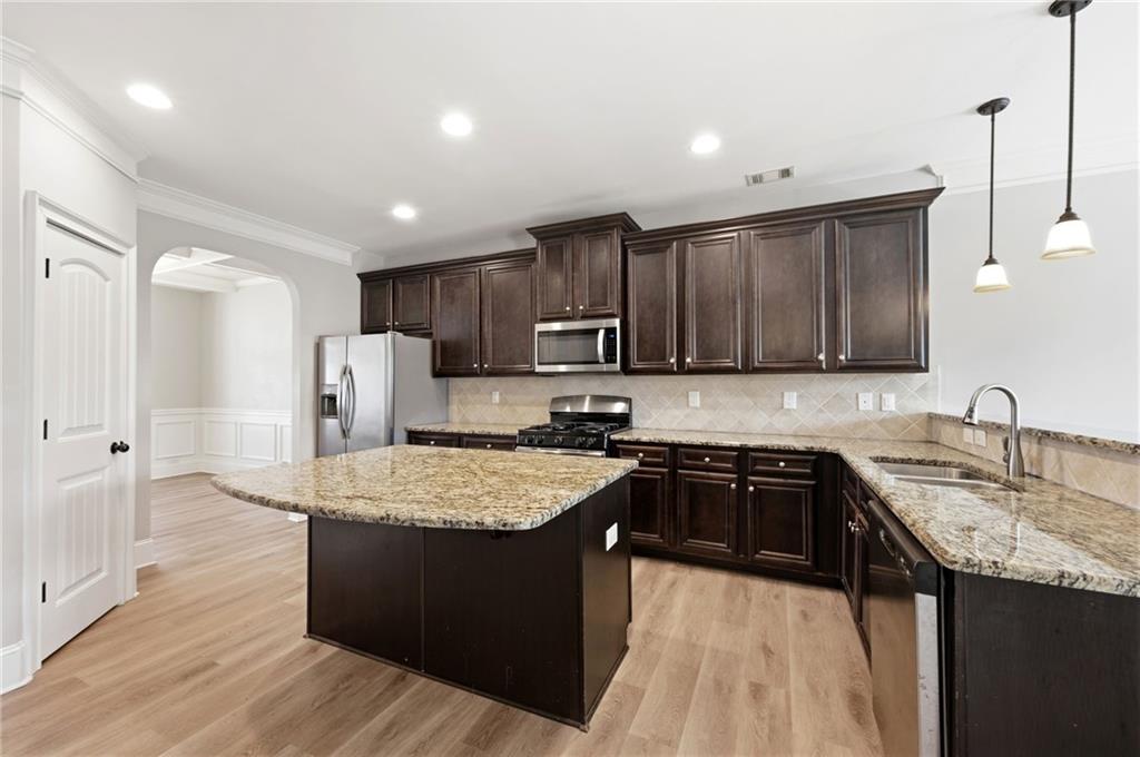 268 Clubhouse Crossing Acworth, GA 30101 - Photo 15 of 48 a kitchen with a sink a stove a refrigerator and cabinets
