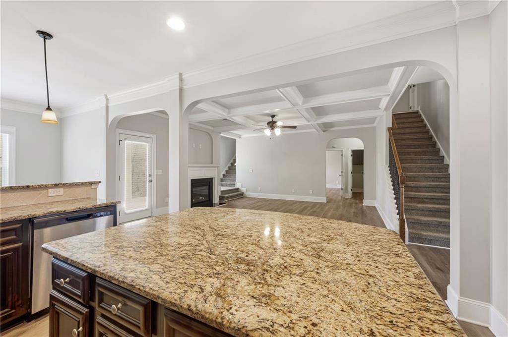 268 Clubhouse Crossing Acworth, GA 30101 - Photo 16 of 48 a kitchen with kitchen island a sink stove and refrigerator