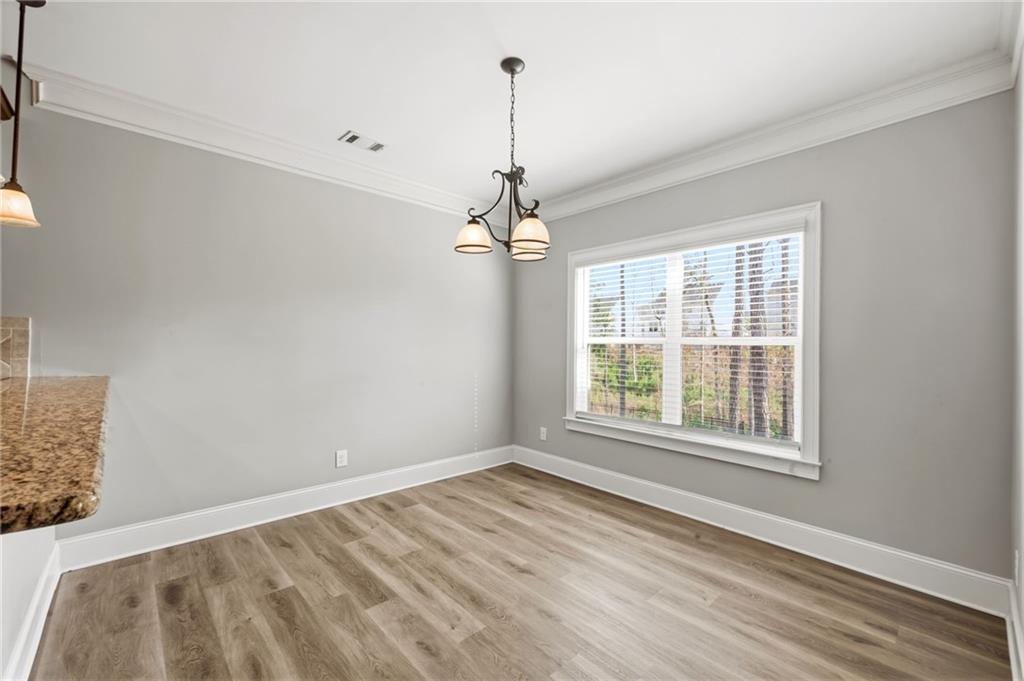 268 Clubhouse Crossing Acworth, GA 30101 - Photo 18 of 48 a view of a room with windows and chandelier