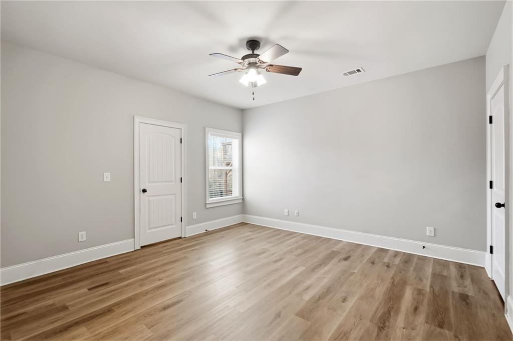 268 Clubhouse Crossing Acworth, GA 30101 - Photo 23 of 48 wooden floor in an empty room with a window