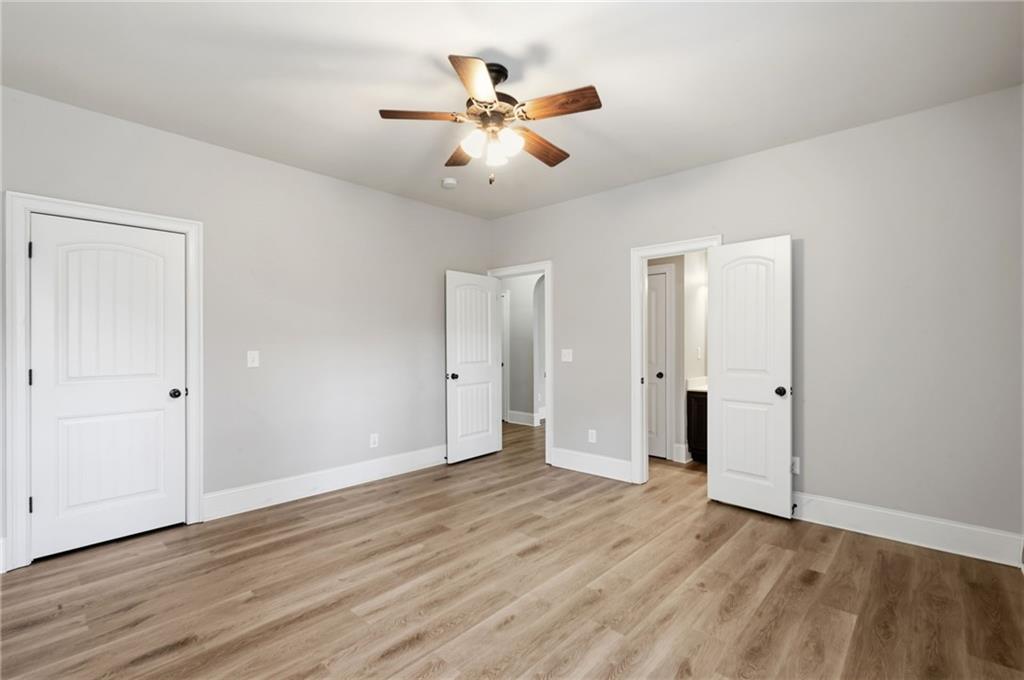 268 Clubhouse Crossing Acworth, GA 30101 - Photo 24 of 48 a view of an empty room with wooden floor
