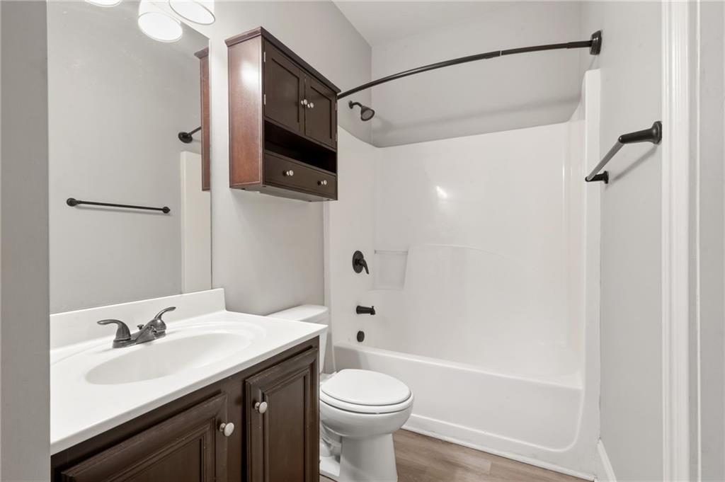 268 Clubhouse Crossing Acworth, GA 30101 - Photo 25 of 48 a bathroom with a sink a toilet and shower