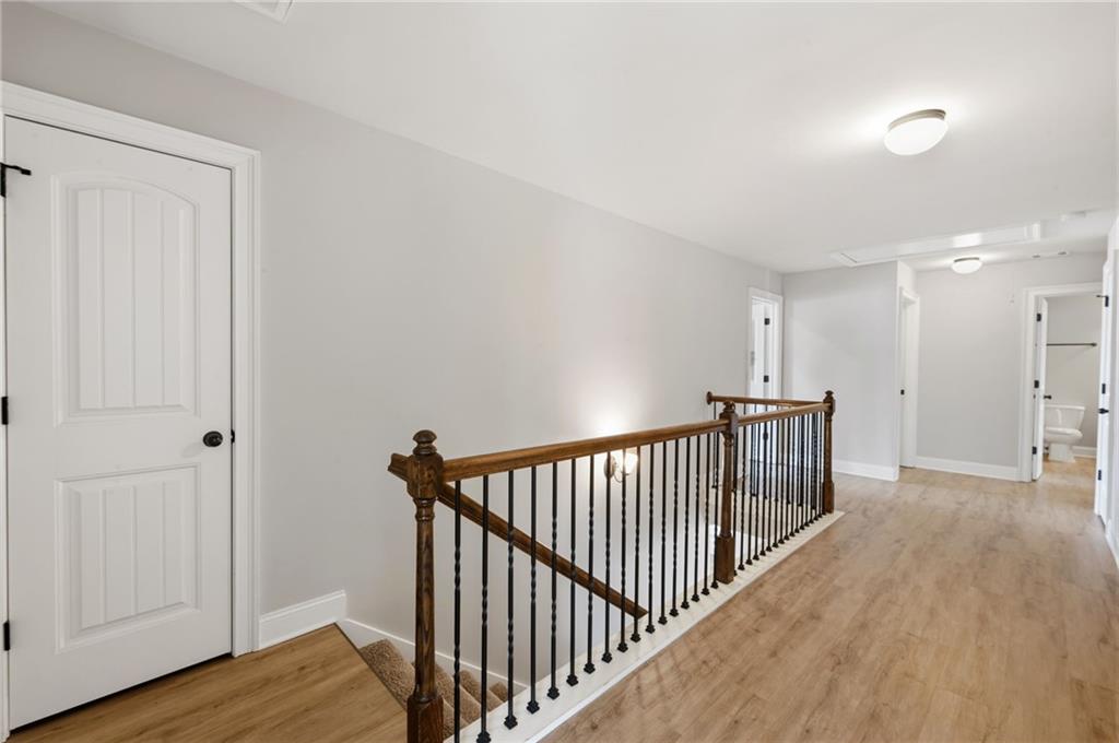 268 Clubhouse Crossing Acworth, GA 30101 - Photo 28 of 48 a view of a hallway with wooden floor