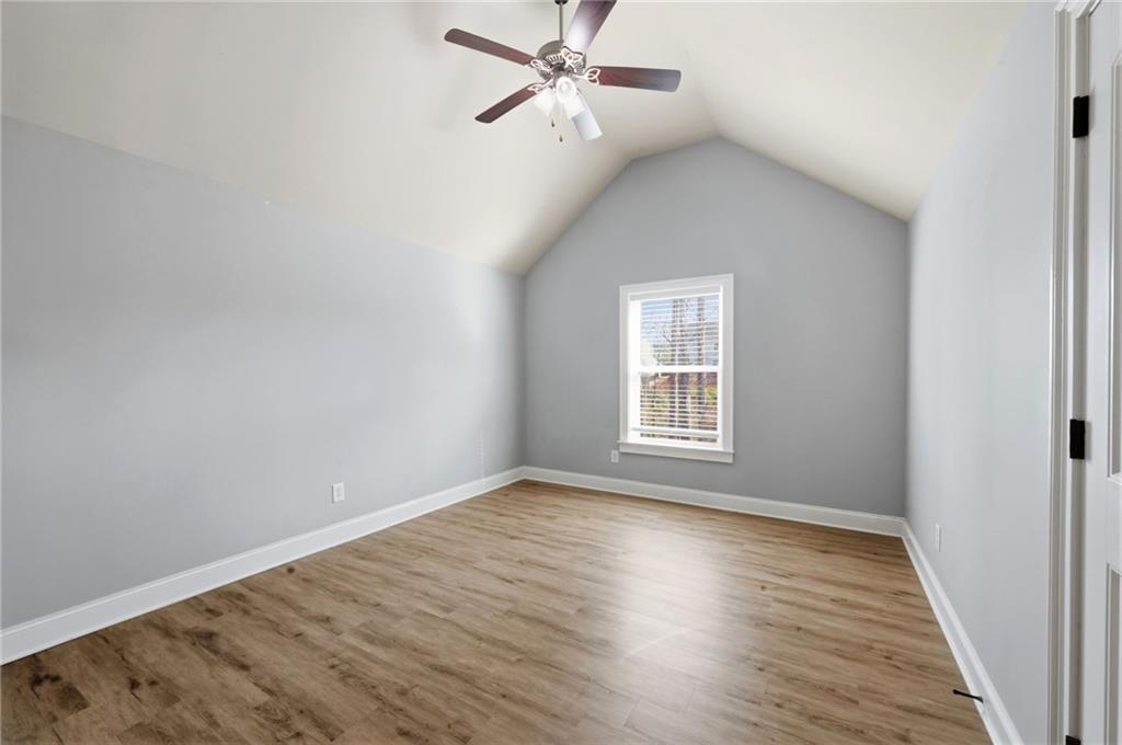 268 Clubhouse Crossing Acworth, GA 30101 - Photo 34 of 48 a view of an empty room with wooden floor and a window