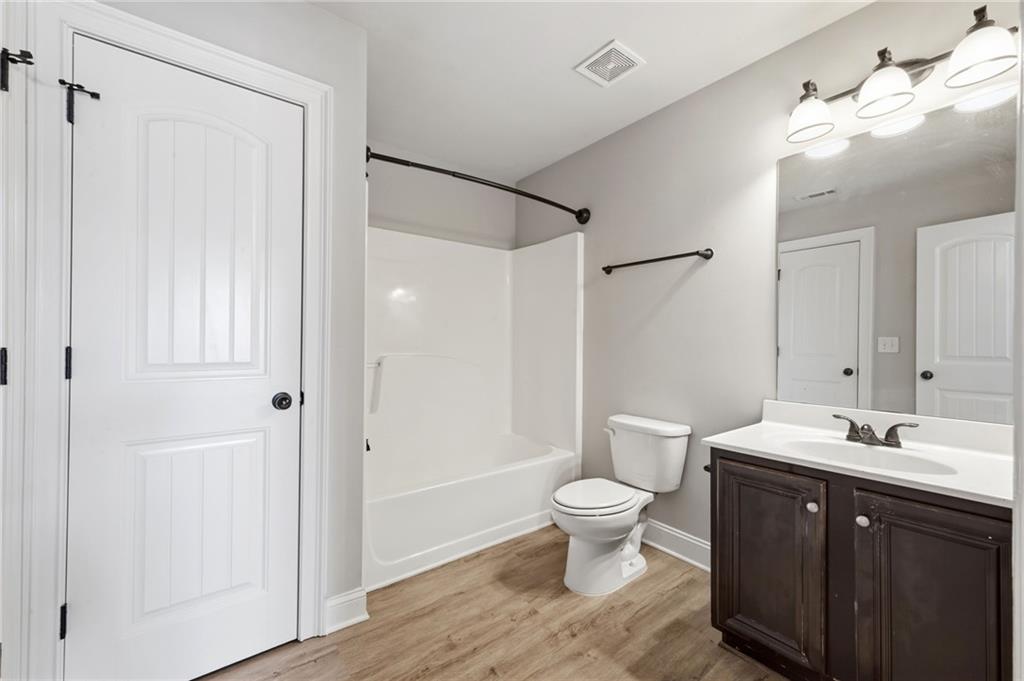 268 Clubhouse Crossing Acworth, GA 30101 - Photo 36 of 48 a bathroom with a double vanity sink toilet and shower