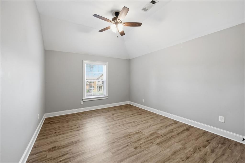 268 Clubhouse Crossing Acworth, GA 30101 - Photo 37 of 48 wooden floor in an empty room with a window