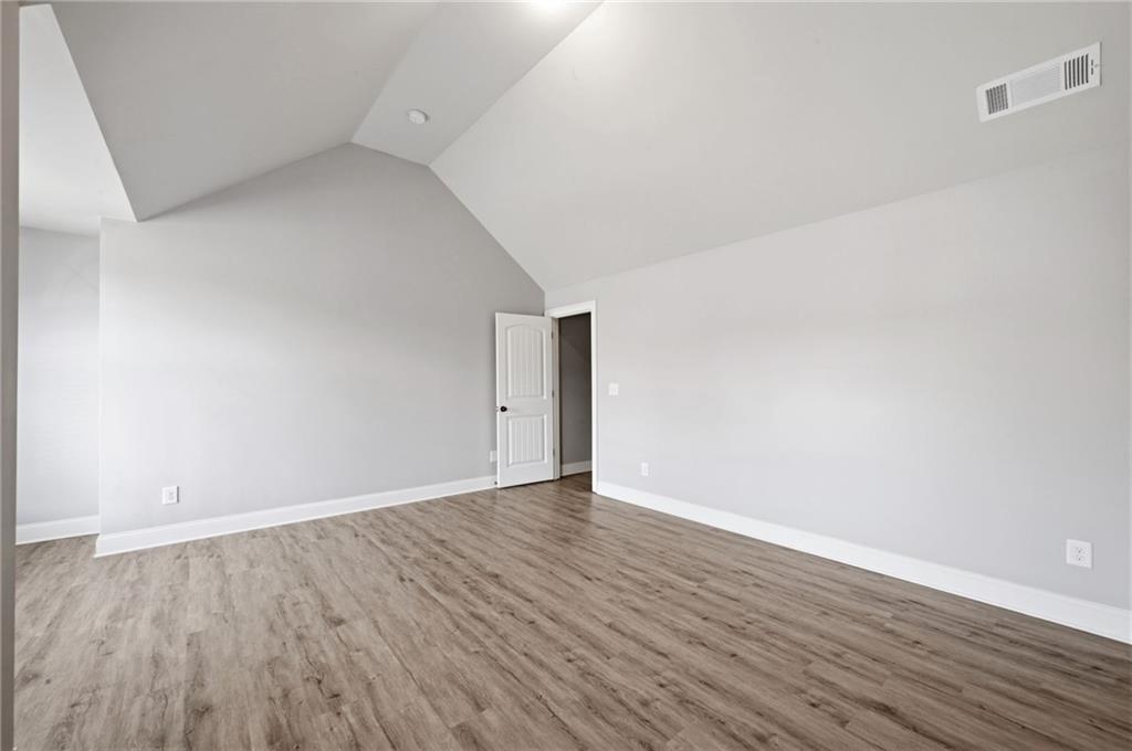268 Clubhouse Crossing Acworth, GA 30101 - Photo 41 of 48 a view of an empty room with wooden floor