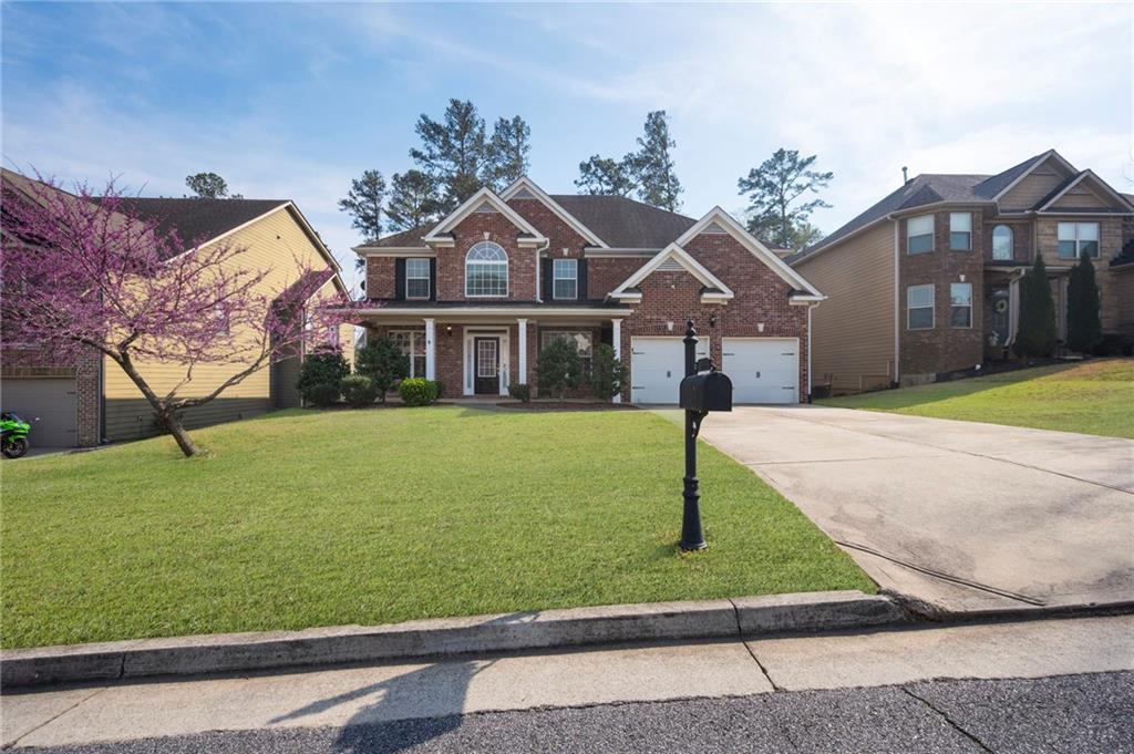 268 Clubhouse Crossing Acworth, GA 30101 - Photo 5 of 48 a front view of a house with a yard