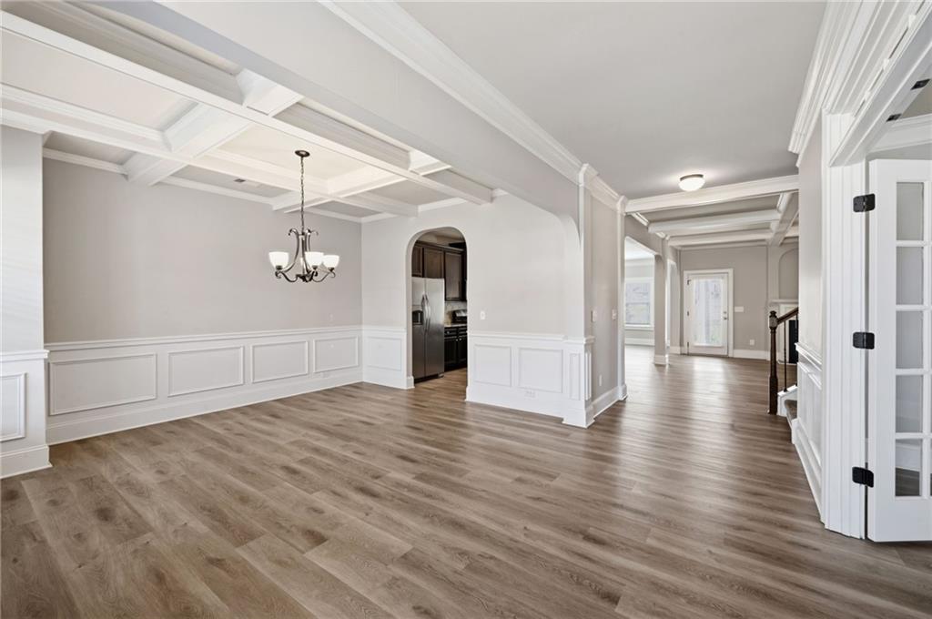 268 Clubhouse Crossing Acworth, GA 30101 - Photo 8 of 48 a view of a hallway with wooden floor and staircase
