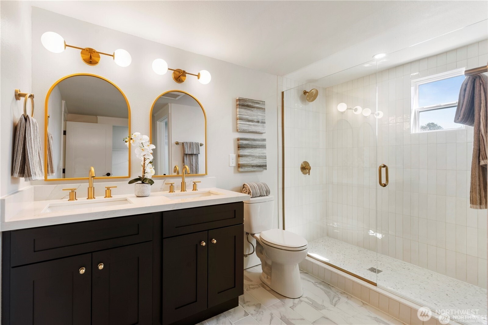 3221 36th Avenue South Seattle, WA 98144 - Photo 10 of 13 a bathroom with a double vanity sink toilet mirror and shower