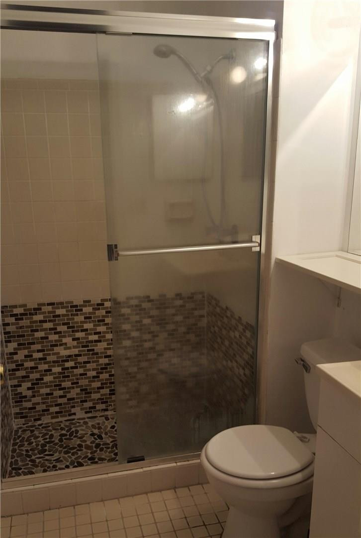 19258 Liberty Road Boca Raton, FL 33434 - Photo 7 of 11 a bathroom with a toilet and a shower
