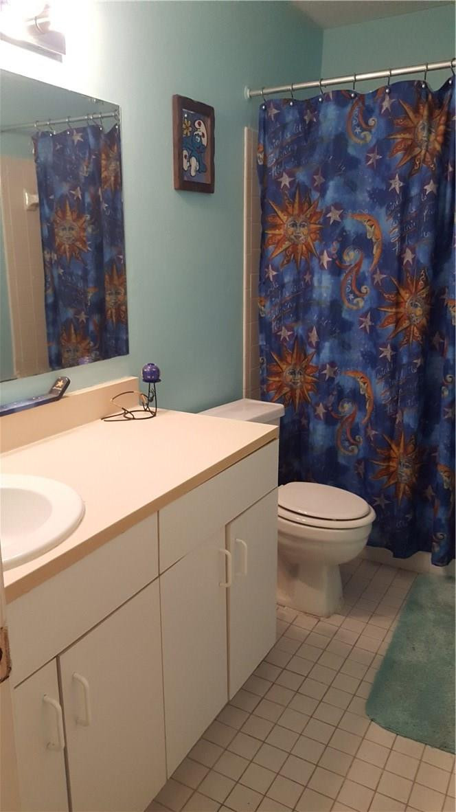 19258 Liberty Road Boca Raton, FL 33434 - Photo 8 of 11 a bathroom with a toilet and a sink