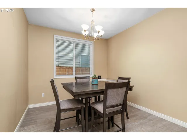 a view of a dining room with furniture and window