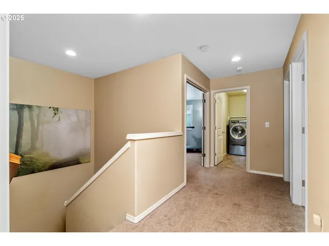 a view of a hallway with stairs
