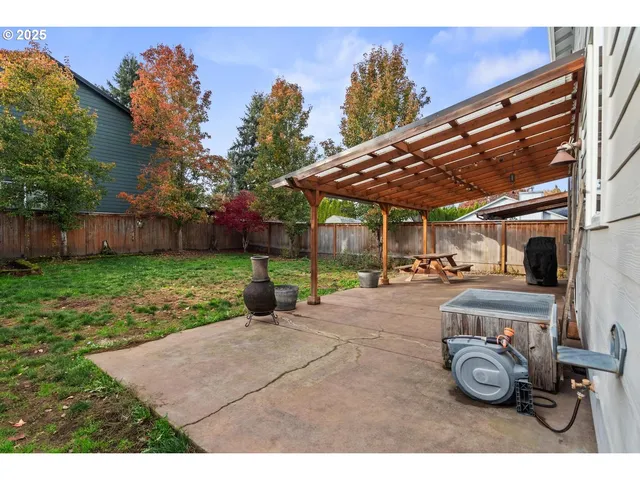 a view of a backyard with sitting area and furniture