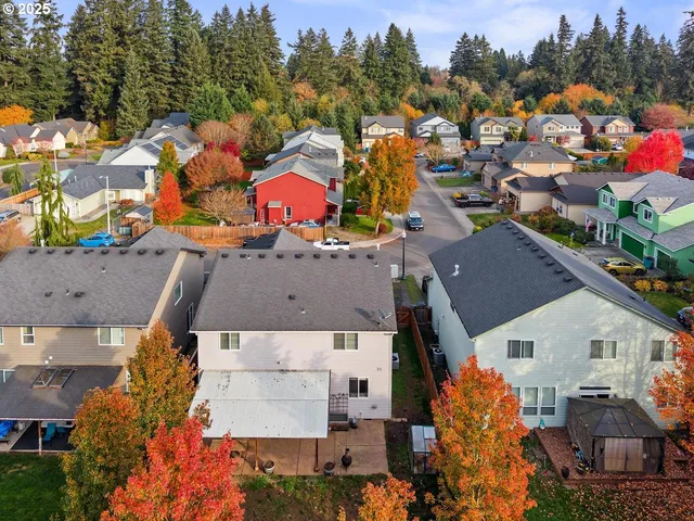 an aerial view of houses with outdoor space