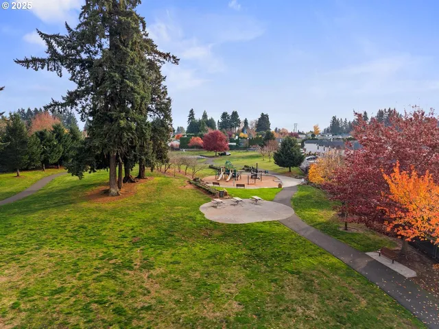 a view of a swimming pool a yard and outdoor seating