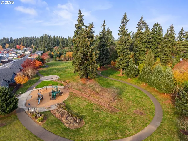 a view of a swimming pool in a backyard
