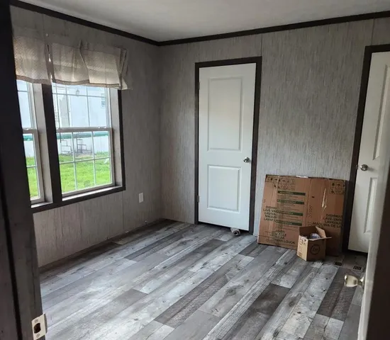 a view of an empty room and window