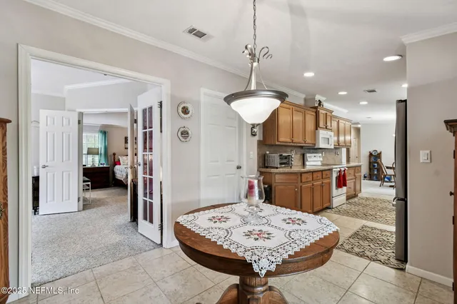 a kitchen with stainless steel appliances granite countertop a refrigerator stove and sink