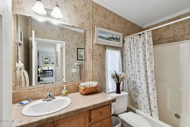 a spacious bathroom with a granite countertop sink mirror and bathtub