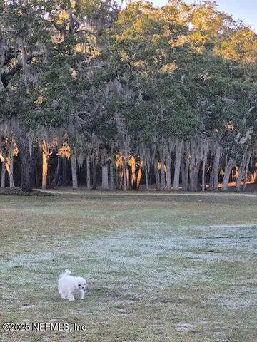 a kitchen with stainless steel appliances a sink stove and cabinets