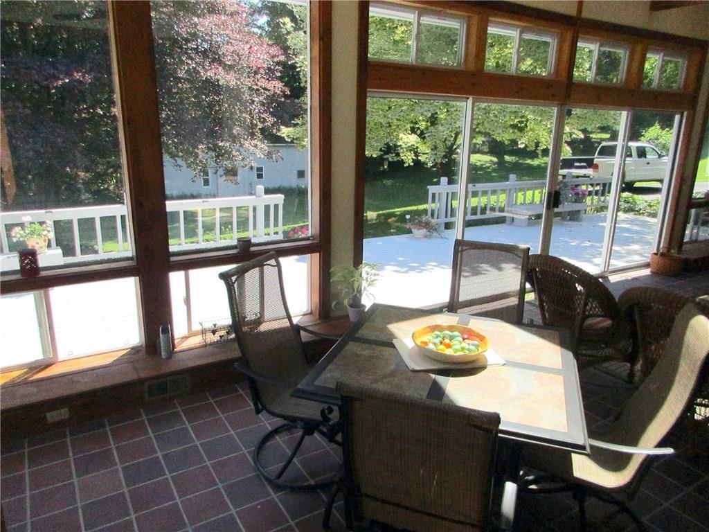 650 Neck Road South China, ME 04358 - Photo 15 of 36 Sun room looking out to the deck and...