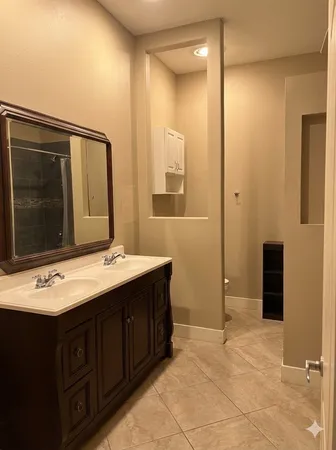 a bathroom with a sink and a mirror