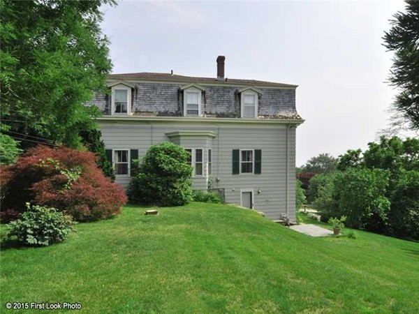 355 Highland Road Tiverton, RI 02878 - Photo 19 of 26 a front view of a house with a yard