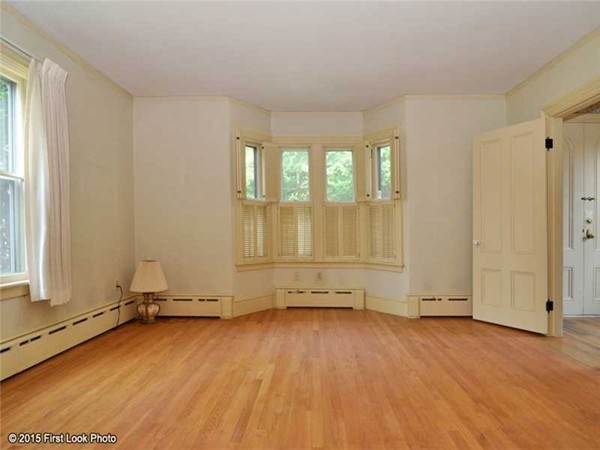 355 Highland Road Tiverton, RI 02878 - Photo 5 of 26 an empty room with wooden floor and window