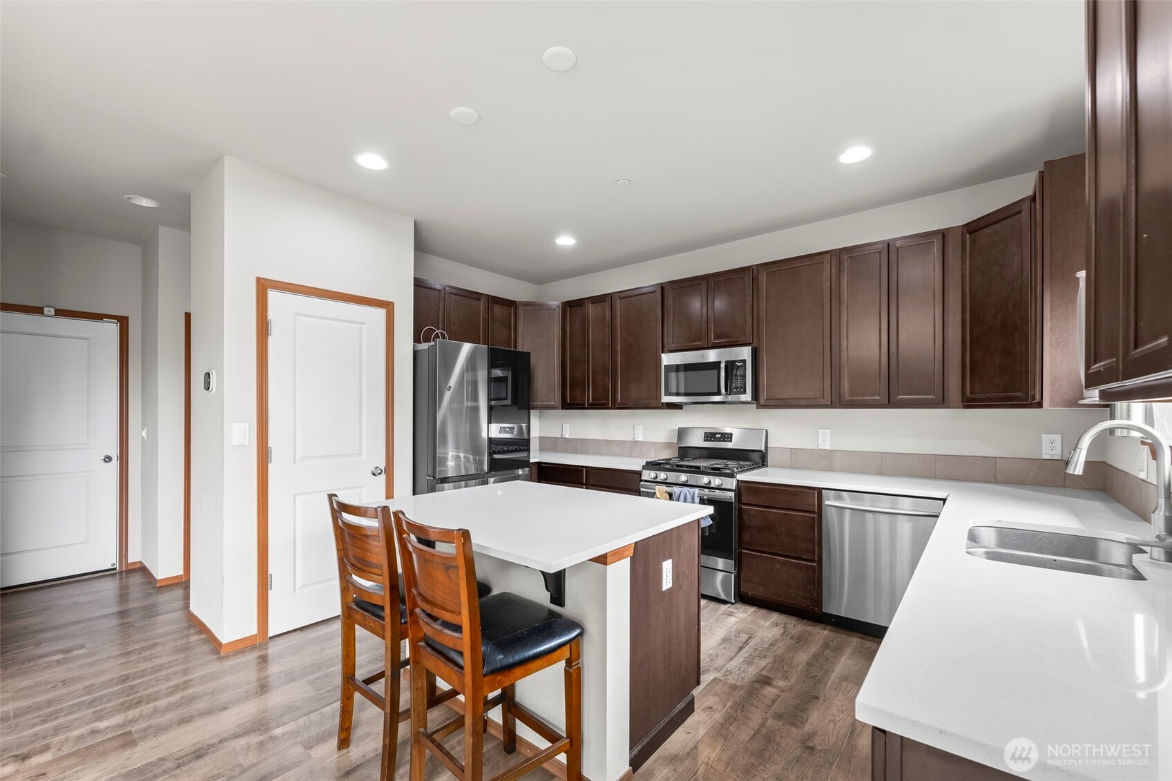 2540 Filbert Avenue Bremerton, WA 98310 - Photo 12 of 28 a kitchen with stainless steel appliances granite countertop a refrigerator stove microwave and sink