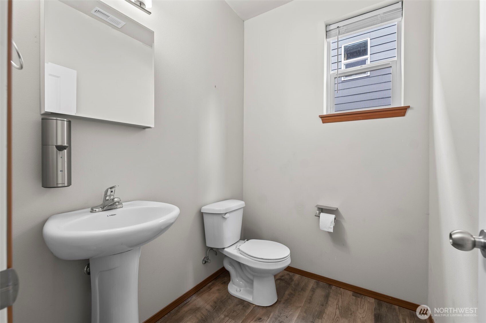 2540 Filbert Avenue Bremerton, WA 98310 - Photo 16 of 28 a bathroom with a toilet sink and mirror