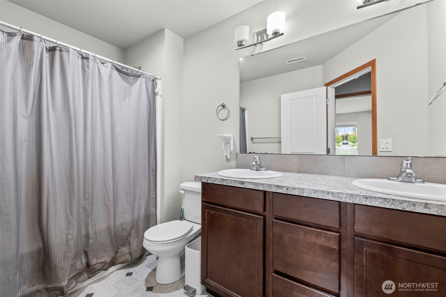 2540 Filbert Avenue Bremerton, WA 98310 - Photo 19 of 28 a bathroom with a granite countertop sink toilet and a mirror