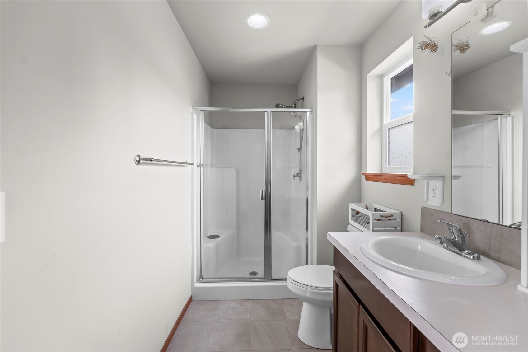 2540 Filbert Avenue Bremerton, WA 98310 - Photo 22 of 28 a bathroom with a sink toilet vanity and shower