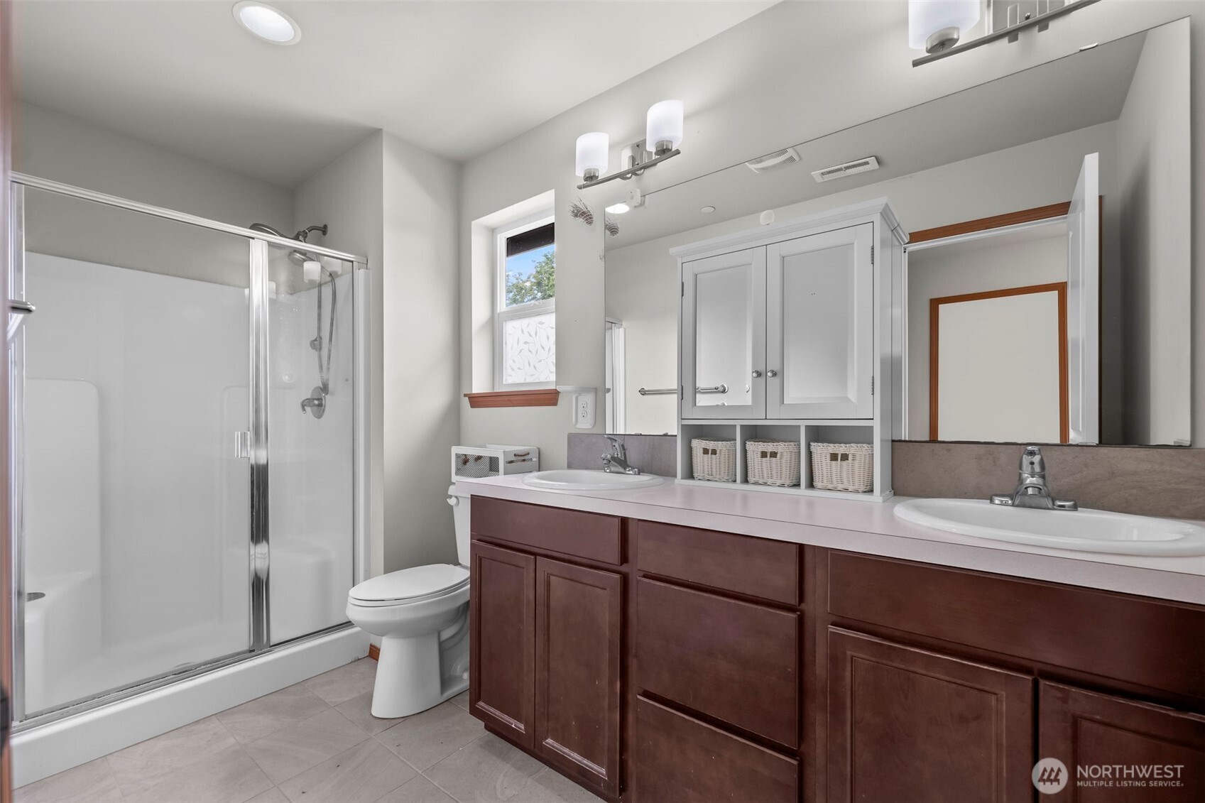 2540 Filbert Avenue Bremerton, WA 98310 - Photo 23 of 28 a bathroom with a double vanity sink toilet mirror and shower