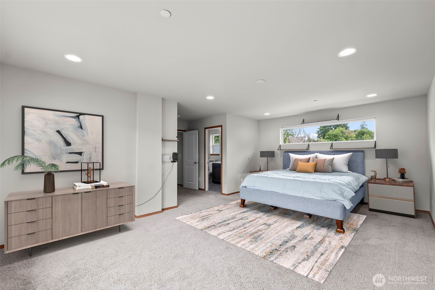 2540 Filbert Avenue Bremerton, WA 98310 - Photo 25 of 28 a spacious bedroom with a large bed and a chandelier