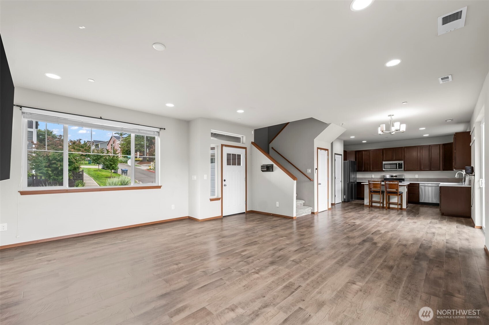 2540 Filbert Avenue Bremerton, WA 98310 - Photo 5 of 28 a view of a room with chairs wooden floor and a window