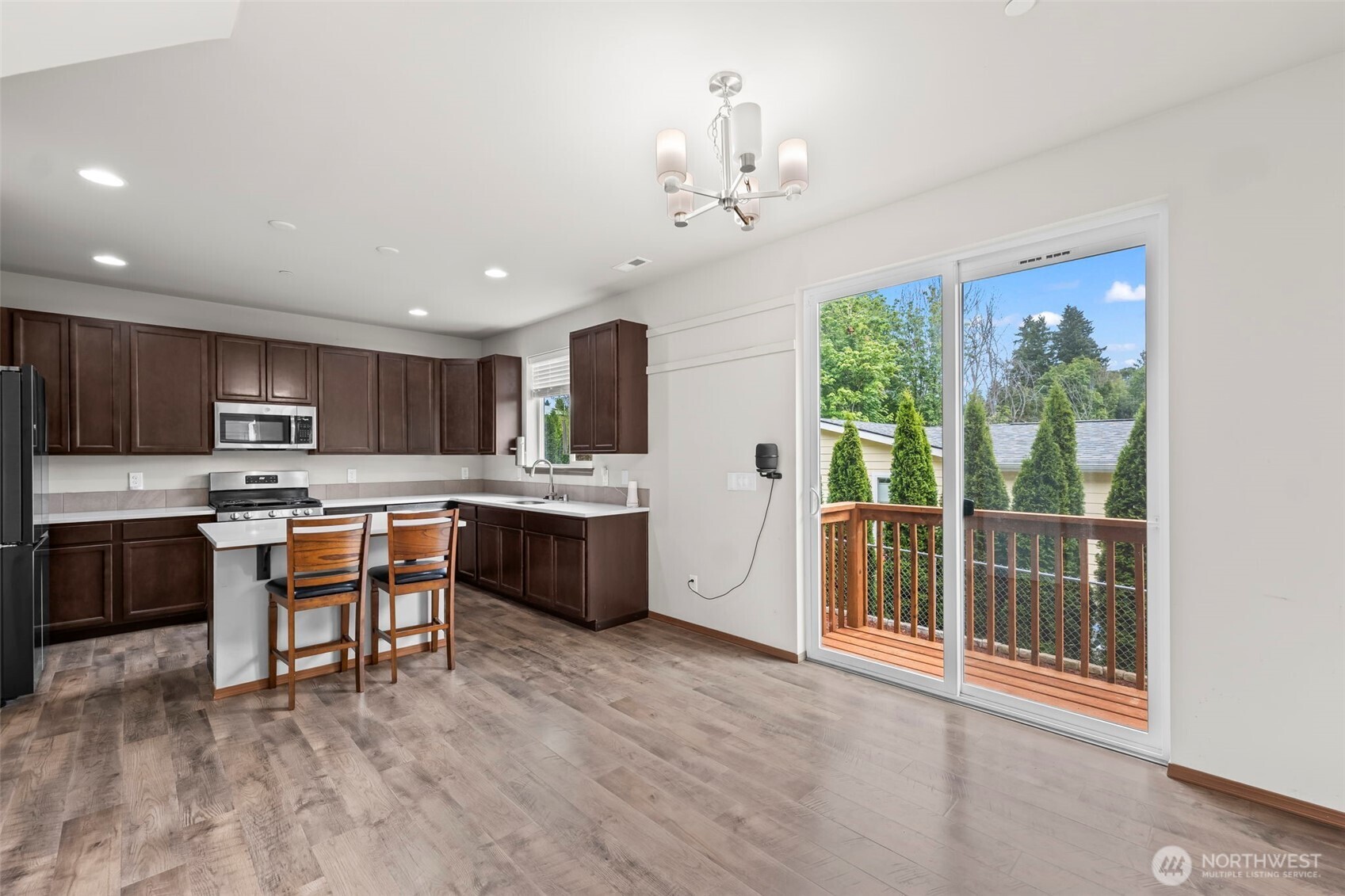 2540 Filbert Avenue Bremerton, WA 98310 - Photo 10 of 28 a large kitchen with a table and chairs