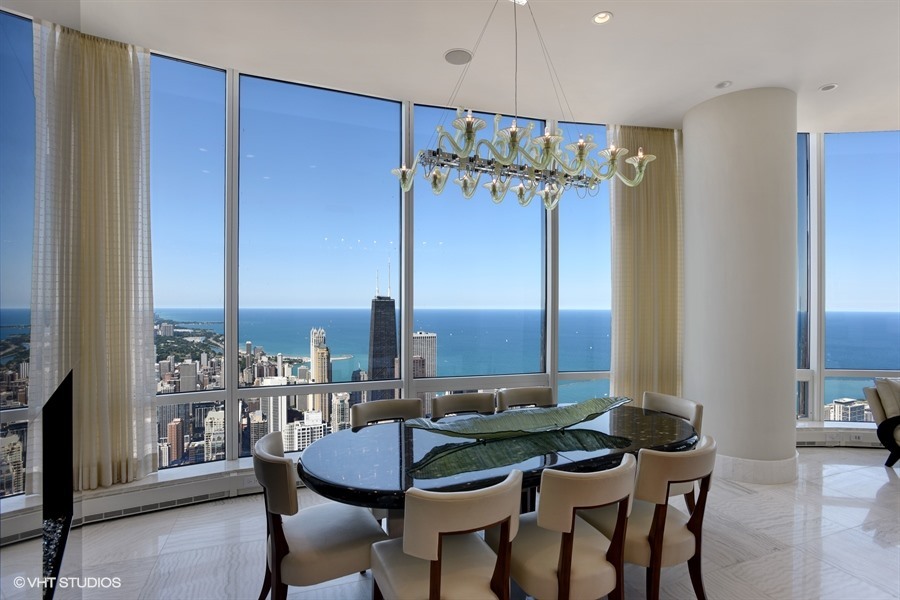 401 North Wabash Avenue, Unit 86A Chicago, IL 60611 - Photo 12 of 54 a view of a dining room with furniture window and wooden floor
