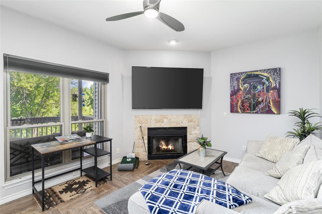 7340 Skillman Street, Unit 1113 Dallas, TX 75231 - Photo 1 of 31 Huges Picture Windows for Natural Light, and a Cozy Woodburning Fireplace w/ TV Mount above!